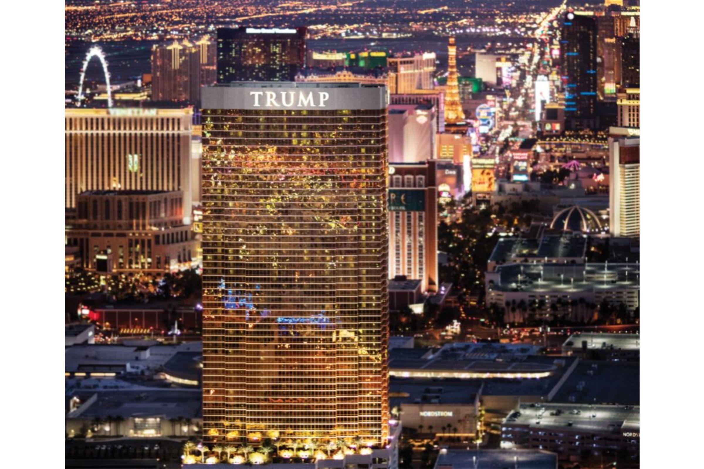 Trump International Hotel Лас Вегас Екстериор снимка The photo showcases the Trump International Hotel Las Vegas, a tall, golden building prominently lit up at night. Surrounding it is the vibrant cityscape of Las Vegas, illuminated by countless lights, including other hotels and attractions in the dis