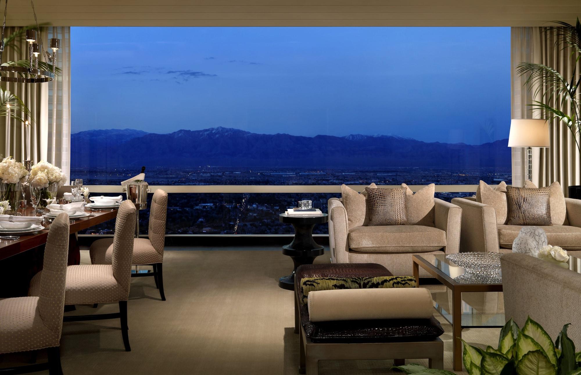 Trump International Hotel Лас Вегас Екстериор снимка The photo depicts a sophisticated interior space, likely a modern lounge or living area. It features soft, neutral-colored furniture, including plush sofas and elegant dining chairs, creating a stylish and inviting atmosphere. Large windows offer a p