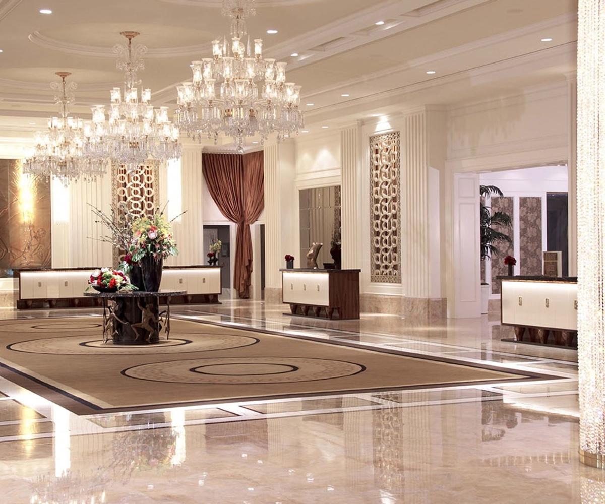 Trump International Hotel Лас Вегас Екстериор снимка The photo shows a luxurious hotel lobby. The space features elegant chandeliers hanging from the ceiling, creating a bright and welcoming atmosphere. There are white and wooden furniture pieces arranged neatly, including low tables and sideboards. A 