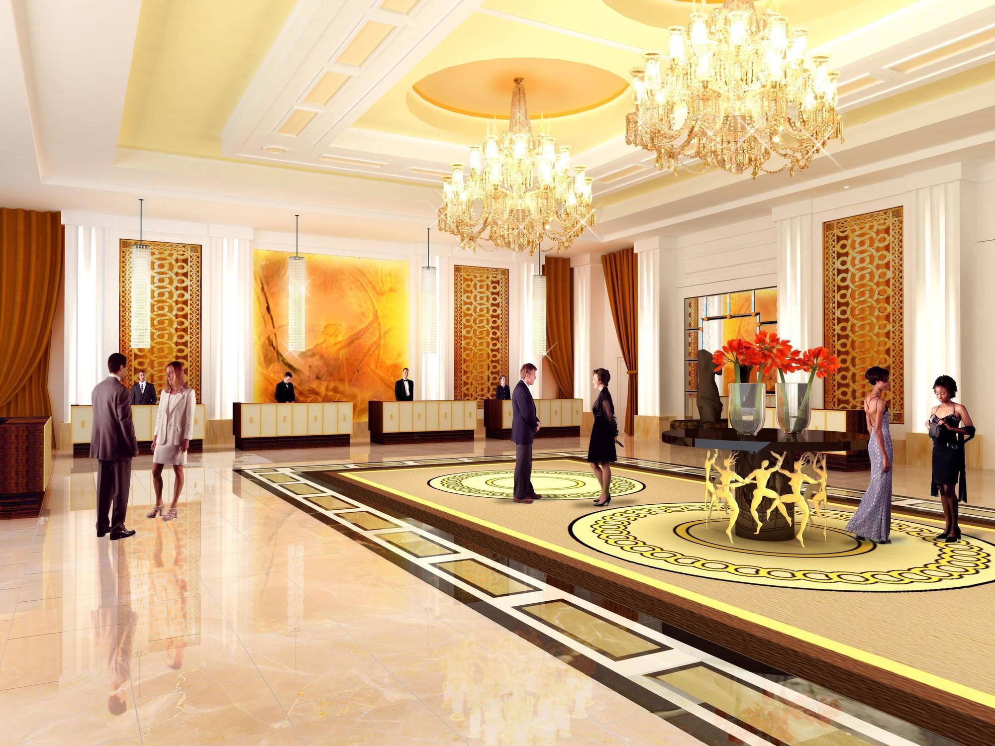 Trump International Hotel Лас Вегас Екстериор снимка The photo depicts a luxurious hotel lobby. The space features elegant decor with high ceilings and ornate chandeliers. The flooring is polished, and a large decorative rug adds sophistication. There are several stylish seating areas, with people dres